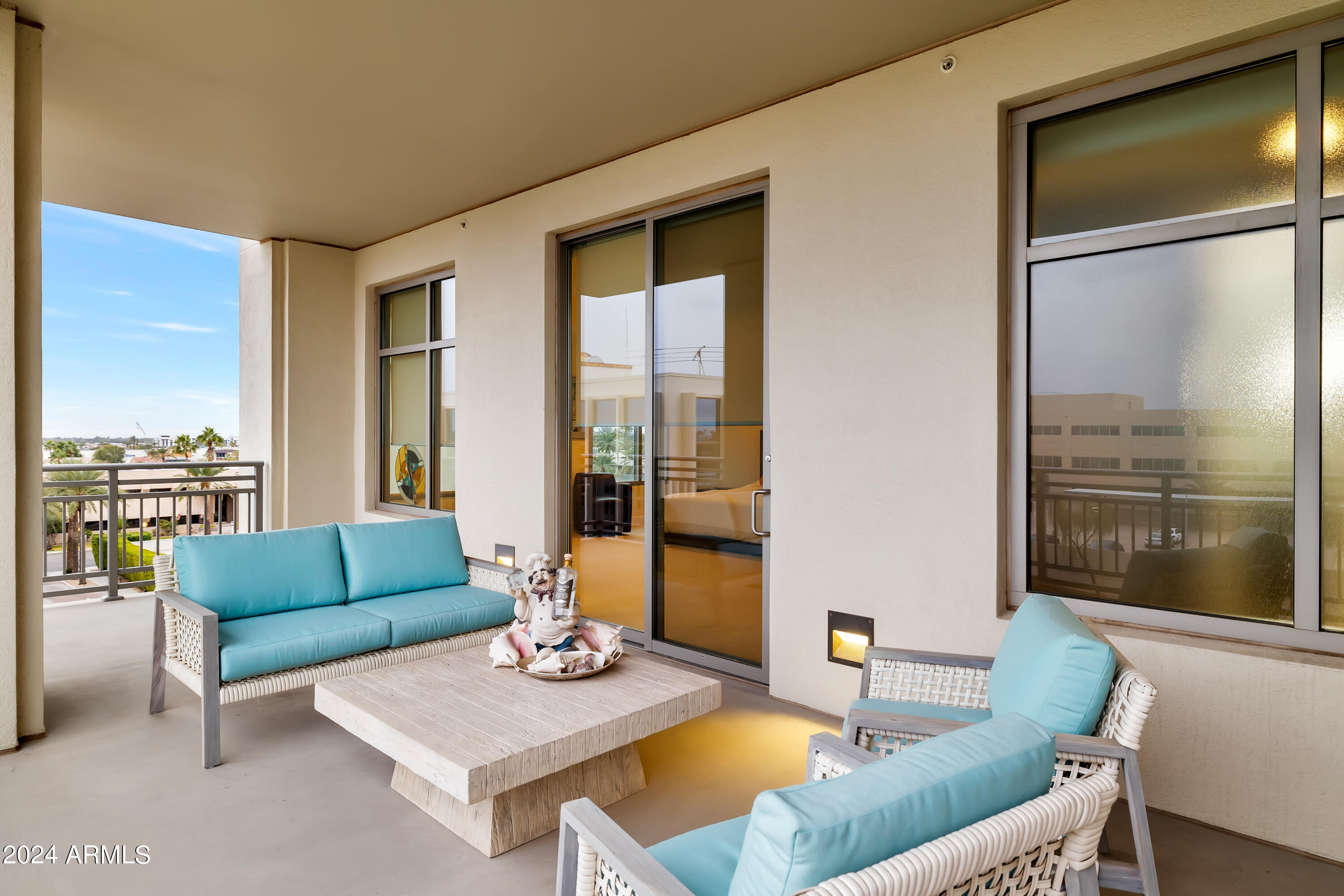 2211 East Camelback Road, Unit 407 Phoenix, AZ 85016 - Photo 36 of 36 a living room with furniture and a large window