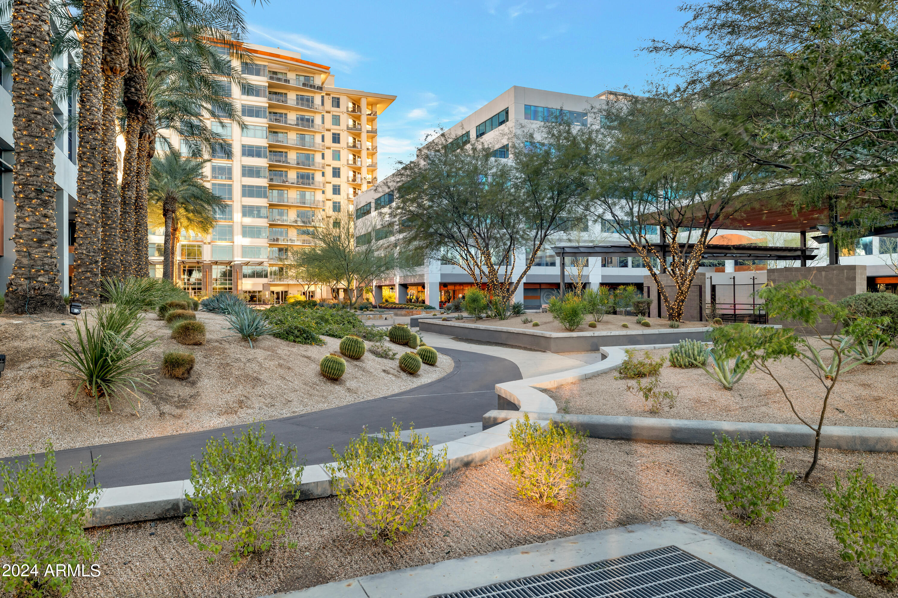 2211 East Camelback Road, Unit 407 Phoenix, AZ 85016 - Photo 10 of 36 a view of yard with seating area and trees around