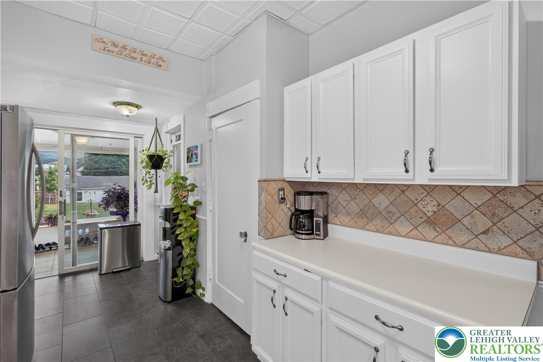 534 Ridge Street Emmaus, PA 18049 - Photo 20 of 40 a kitchen with white cabinets and wooden floor