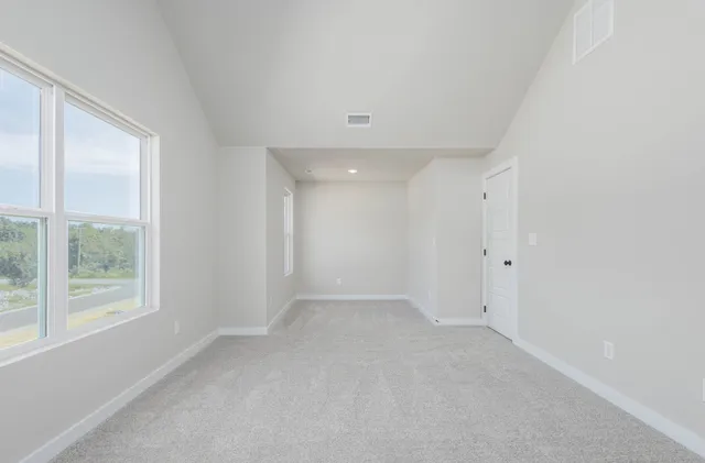 a bathroom with a granite countertop sink a toilet and a bathtub