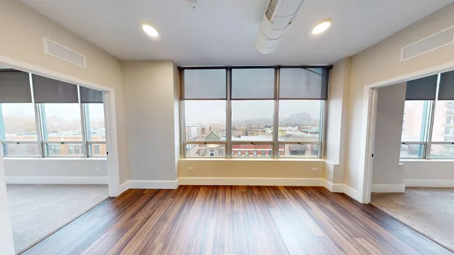 a view of an empty room with a window