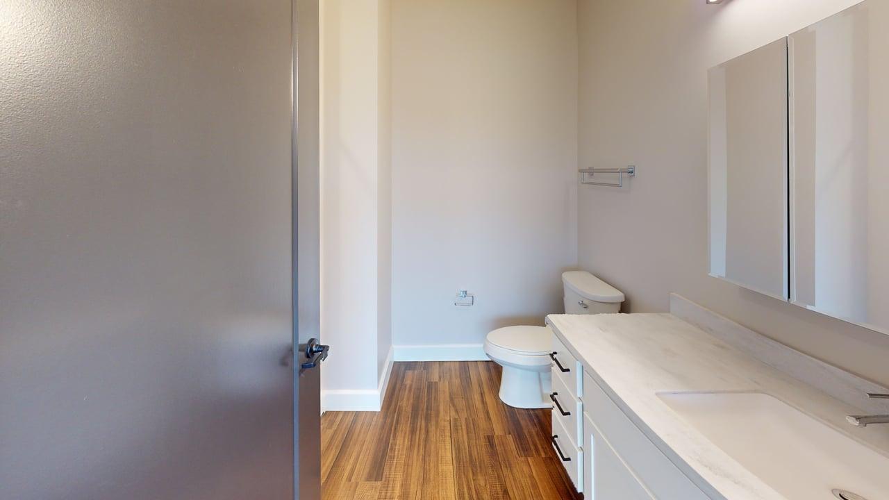 40 Dupage Court, Unit 409 Elgin, IL 60120 - Photo 18 of 22 a bathroom with a sink and toilet