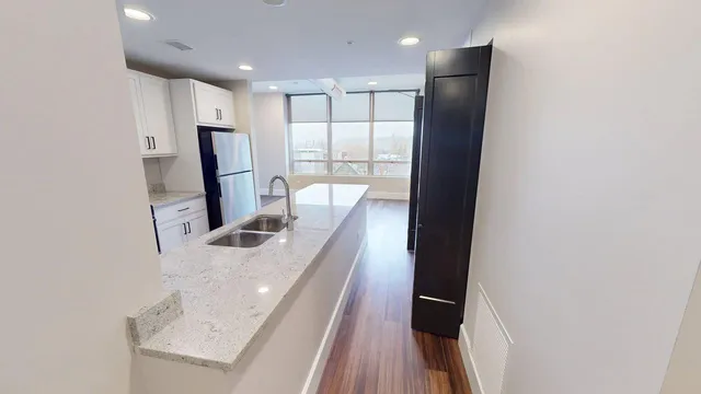 a kitchen with a stove and a refrigerator
