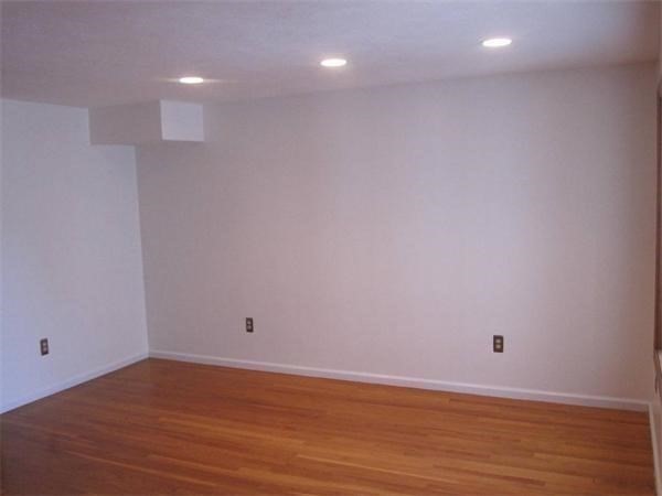 43 Merrymount Road, Unit 7 Quincy, MA 02169 - Photo 14 of 21 a view of room with wooden floor