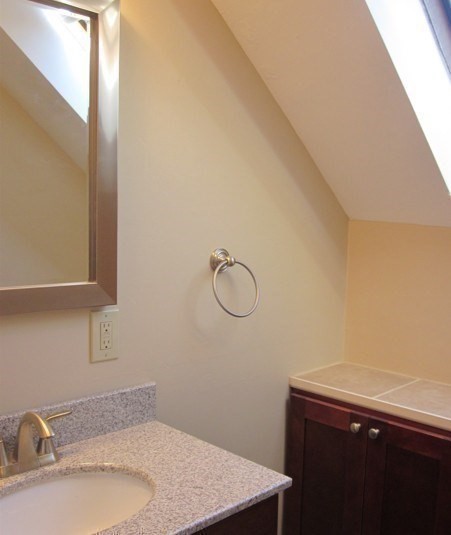 43 Merrymount Road, Unit 7 Quincy, MA 02169 - Photo 17 of 21 a bathroom with a sink and vanity