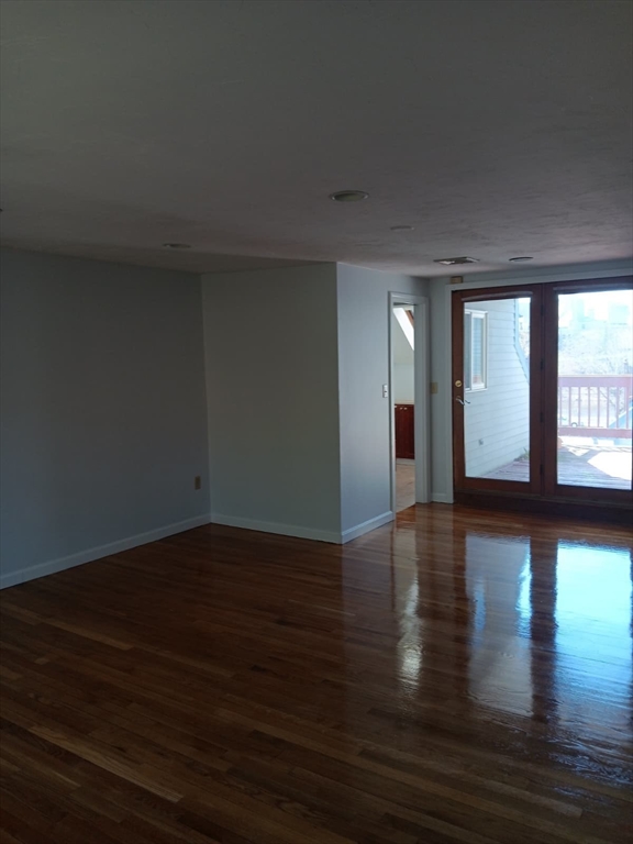 43 Merrymount Road, Unit 7 Quincy, MA 02169 - Photo 21 of 21 a view of a room window and wooden floor