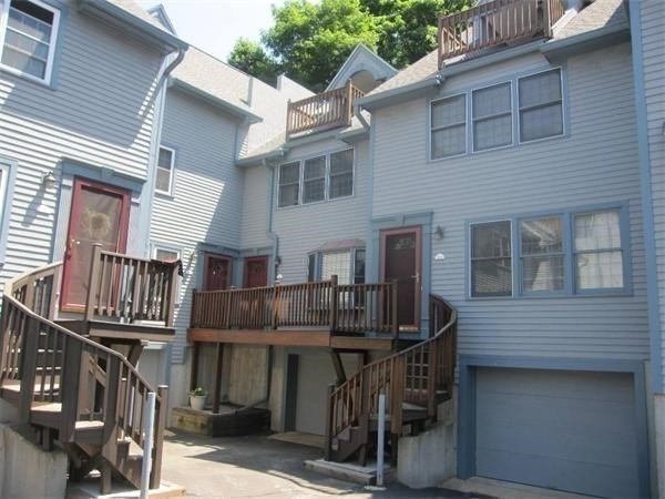 43 Merrymount Road, Unit 7 Quincy, MA 02169 - Photo 3 of 21 a front view of a house with barbeque and seating