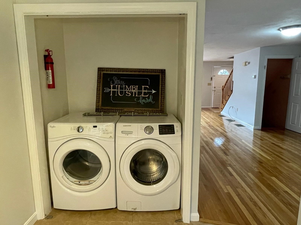 43 Merrymount Road, Unit 7 Quincy, MA 02169 - Photo 4 of 21 a utility room with dryer and washer