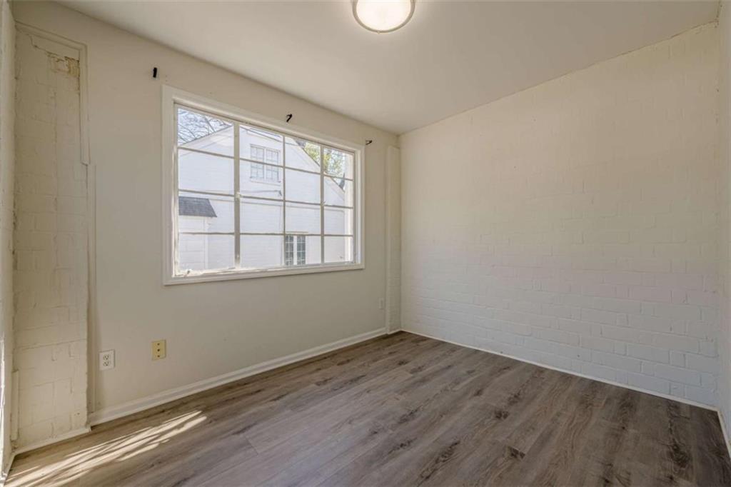 1977 North Decatur Road Atlanta, GA 30307 - Photo 16 of 59 an empty room with wooden floor and windows