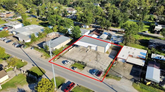 an aerial view of a house with outdoor space
