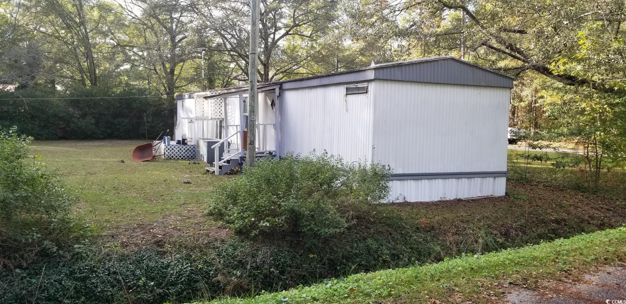 1046 Allen Street Conway, SC 29526 - Photo 6 of 25 View of outbuilding with a yard