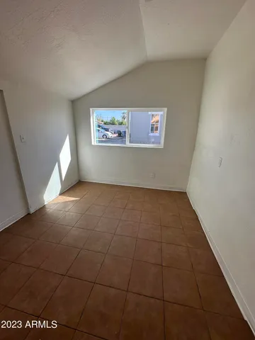 a view of an empty room with a window