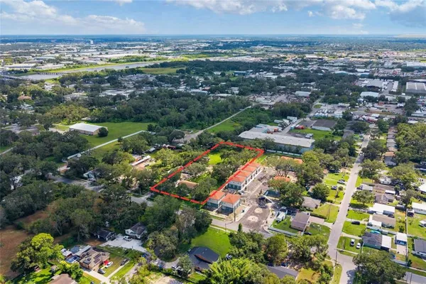 an aerial view of residential houses with outdoor space
