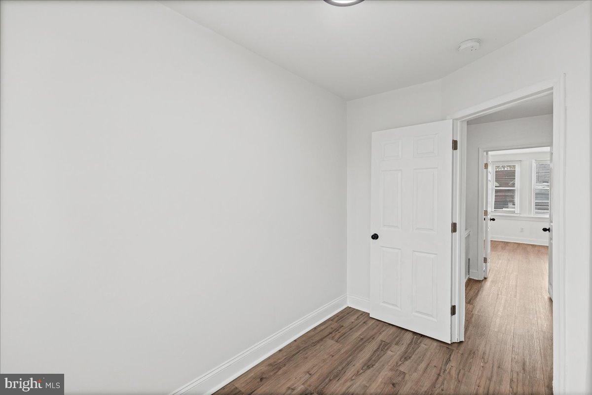 2637 Carroll Street Philadelphia, PA 19142 - Photo 13 of 31 a view of a hallway with wooden floor