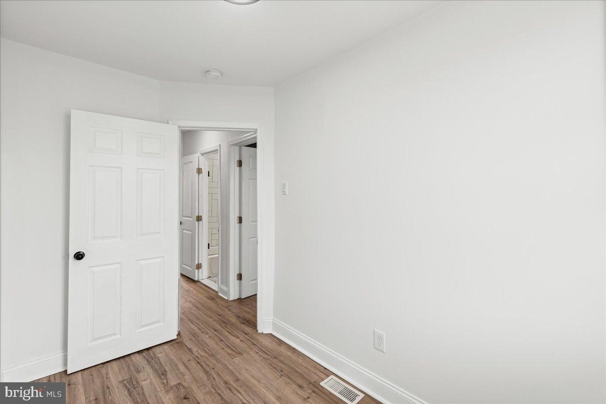 2637 Carroll Street Philadelphia, PA 19142 - Photo 14 of 31 a view of a hallway with wooden floor