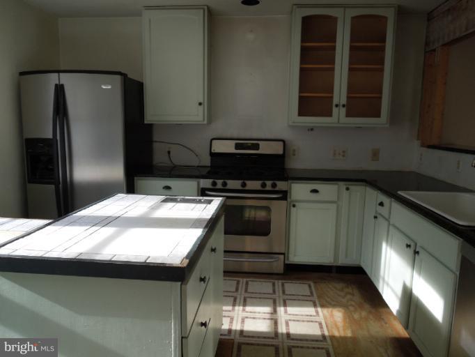 953 Pine Grove Road Bluemont, VA 20135 - Photo 15 of 25 a kitchen with a sink and stainless steel appliances