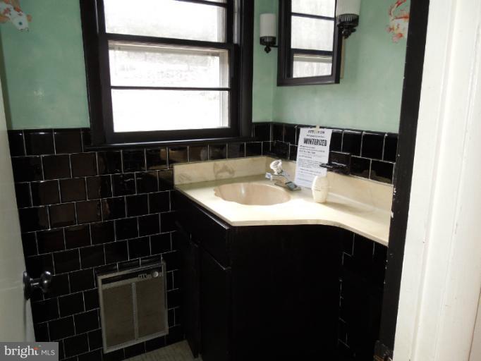 953 Pine Grove Road Bluemont, VA 20135 - Photo 23 of 25 a bathroom with a sink and a mirror