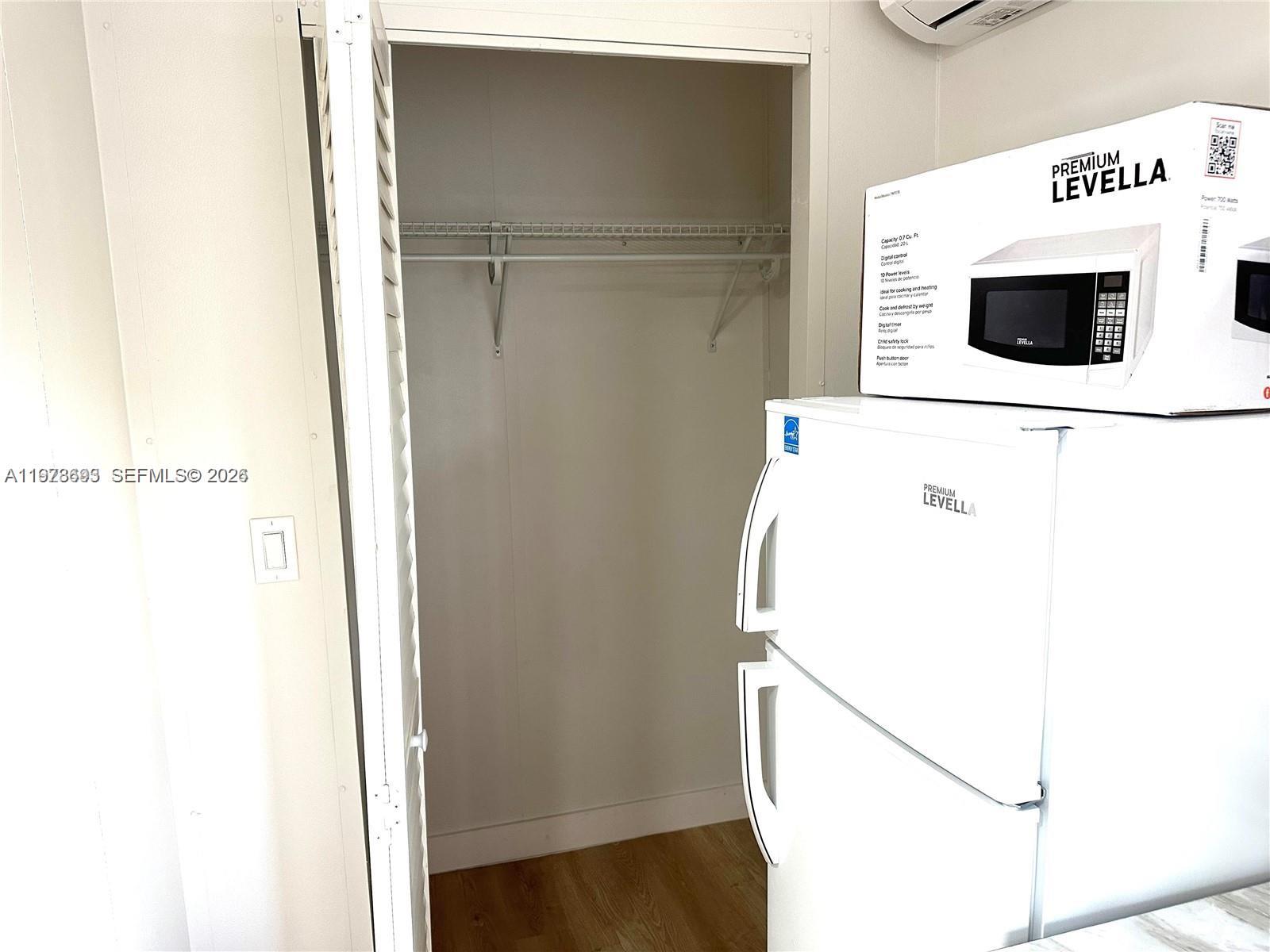 8235 Southwest 41st Terrace, Unit 1 Miami, FL 33155 - Photo 7 of 8 a utility room with dryer and washer