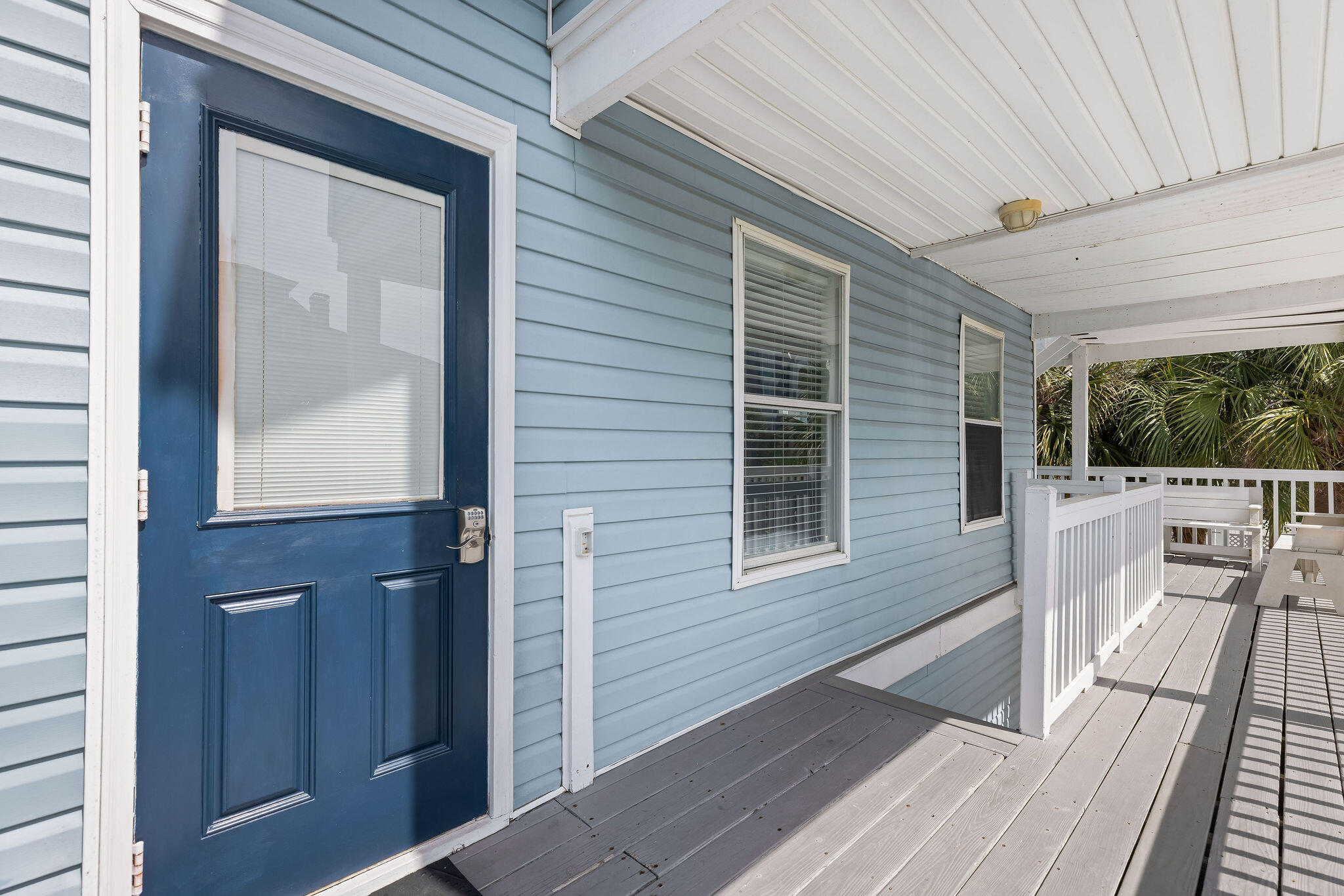 91 Matthew Boulevard Destin, FL 32541 - Photo 58 of 85 a view of a balcony with wooden floor and floor to ceiling window