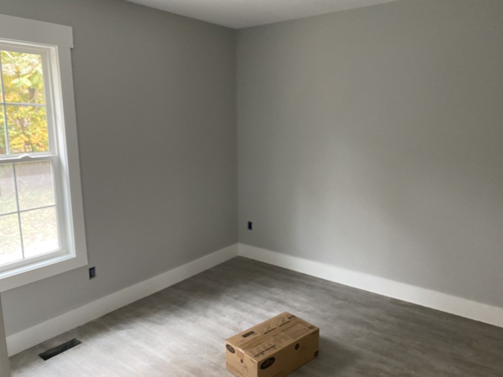 105 Switchboard Road Portland, TN 37148 - Photo 5 of 6 an empty room with wooden floor and windows