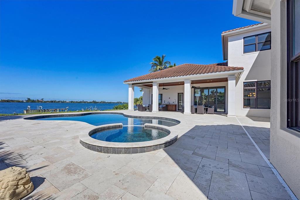 730 Sarabay Road Osprey, FL 34229 - Photo 11 of 95 a view of a house with swimming pool and porch