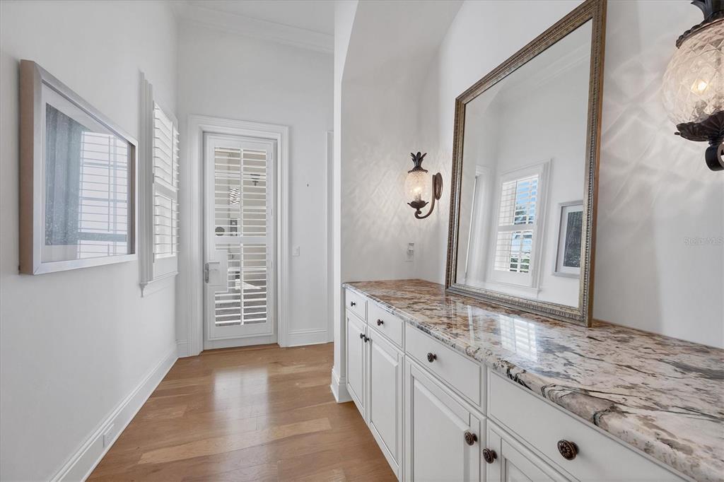730 Sarabay Road Osprey, FL 34229 - Photo 23 of 95 a bathroom with a granite countertop sink and a mirror