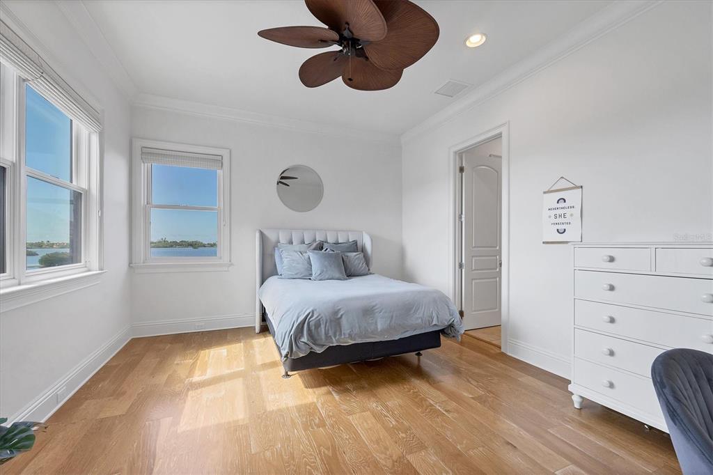 730 Sarabay Road Osprey, FL 34229 - Photo 33 of 95 a spacious bedroom with a bed and a window