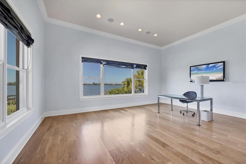 730 Sarabay Road Osprey, FL 34229 - Photo 34 of 95 a view of room with window and wooden floor