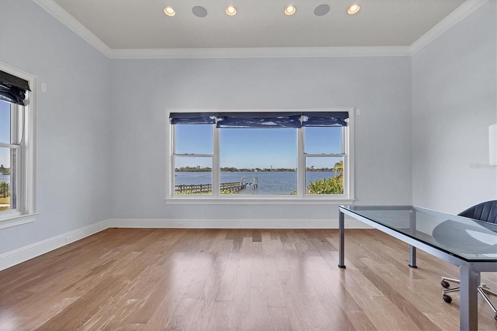 730 Sarabay Road Osprey, FL 34229 - Photo 35 of 95 a view of wooden floor and cabinets in a room