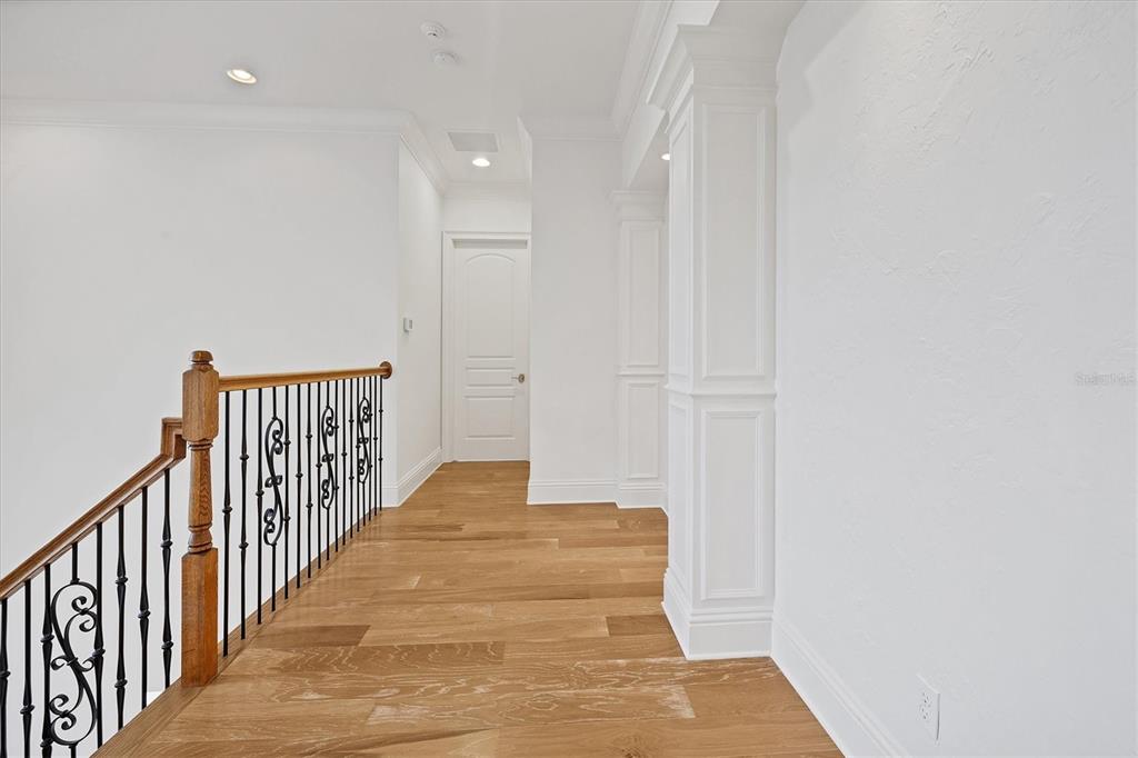 730 Sarabay Road Osprey, FL 34229 - Photo 39 of 95 a view of a hallway with wooden floor