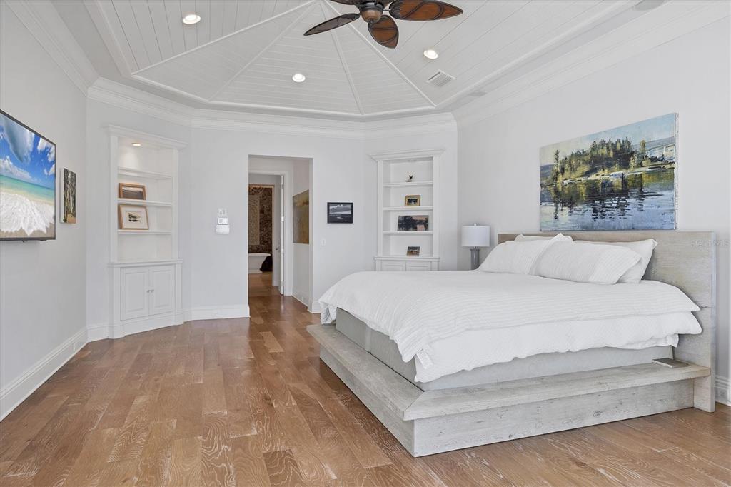 730 Sarabay Road Osprey, FL 34229 - Photo 41 of 95 a bedroom with a bed and painting on the wall