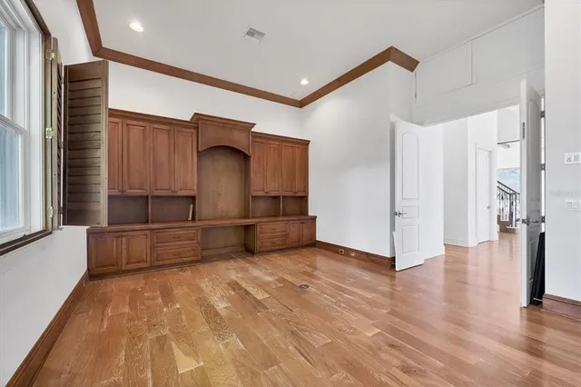 a view of living room with a floor to ceiling window and wooden floor