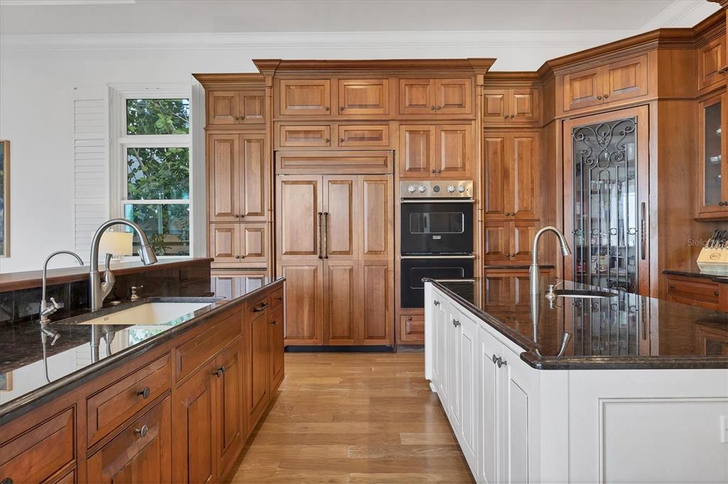 730 Sarabay Road Osprey, FL 34229 - Photo 56 of 95 a kitchen with stainless steel appliances granite countertop a sink and a refrigerator