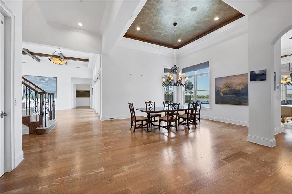 730 Sarabay Road Osprey, FL 34229 - Photo 62 of 95 a view of a dining room with furniture and wooden floor