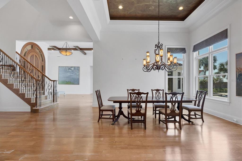 730 Sarabay Road Osprey, FL 34229 - Photo 63 of 95 a view of a dining room with furniture window and wooden floor