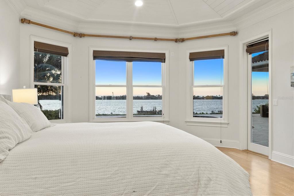 730 Sarabay Road Osprey, FL 34229 - Photo 80 of 95 a spacious bedroom with a large bed and a large window