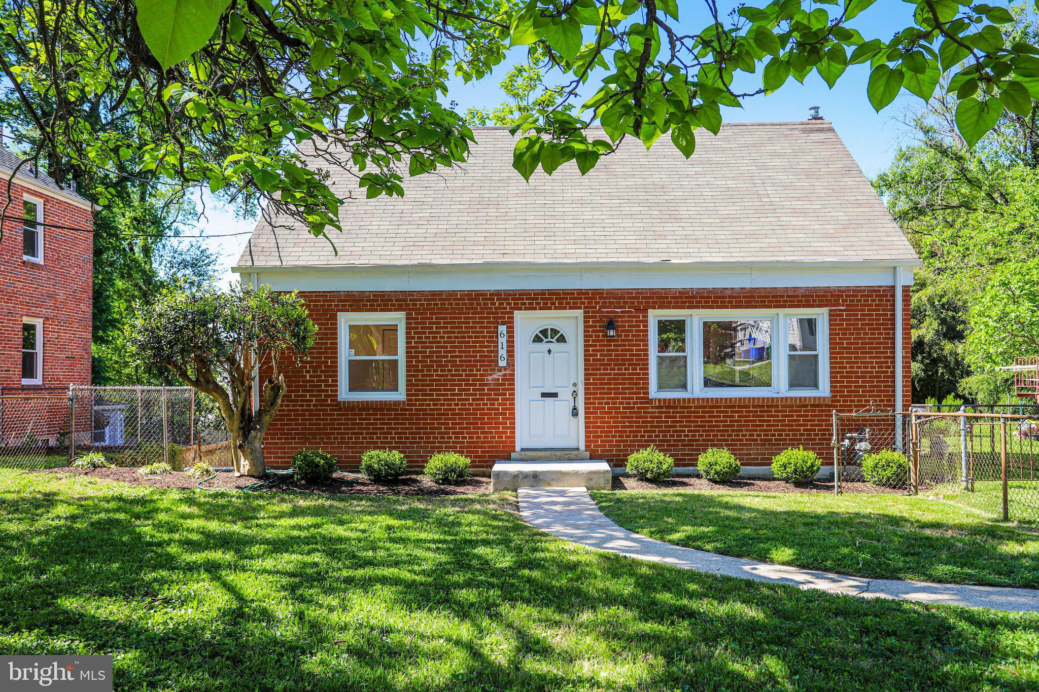 616 Ritchie Avenue Silver Spring, MD 20910 - Photo 1 of 37 a front view of a house with garden
