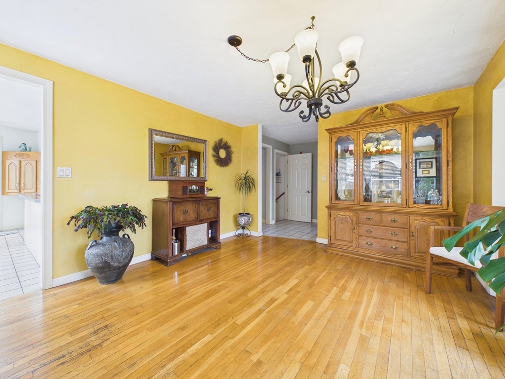 50 Prospect Avenue Hull, MA 02045 - Photo 15 of 41 a view of a livingroom with furniture a chandelier