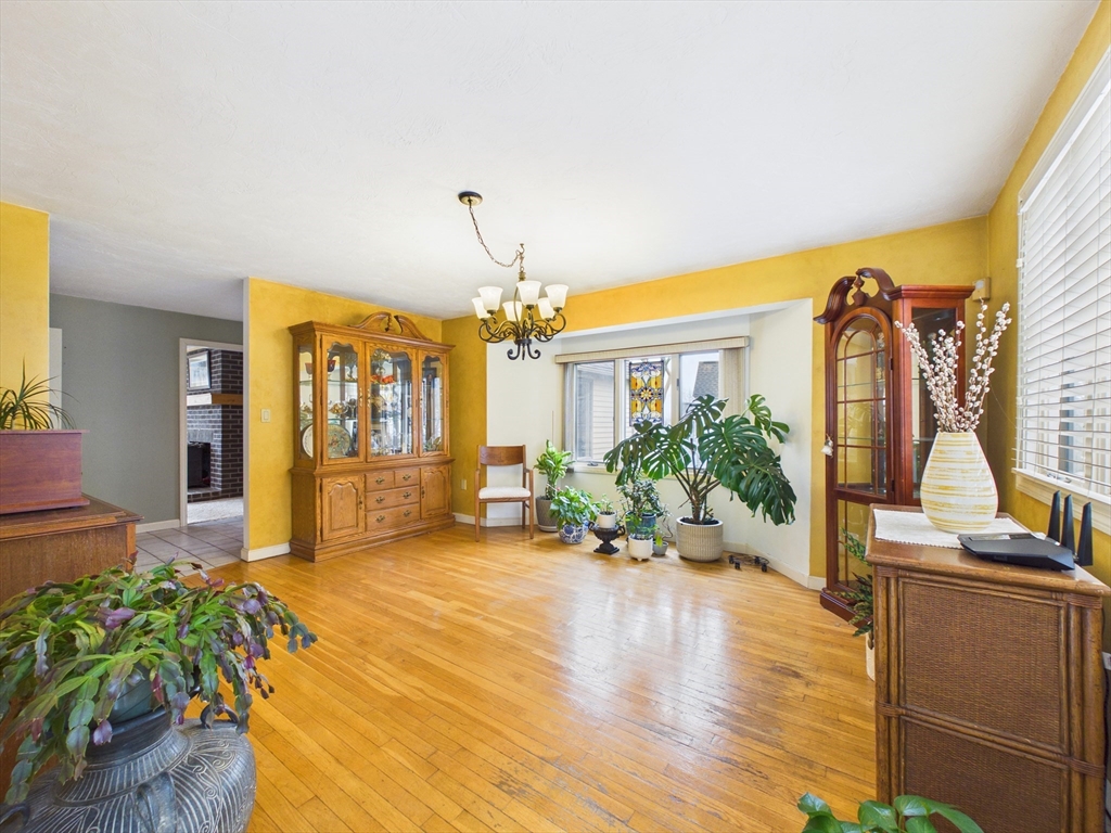 50 Prospect Avenue Hull, MA 02045 - Photo 16 of 41 a living room with furniture and a chandelier