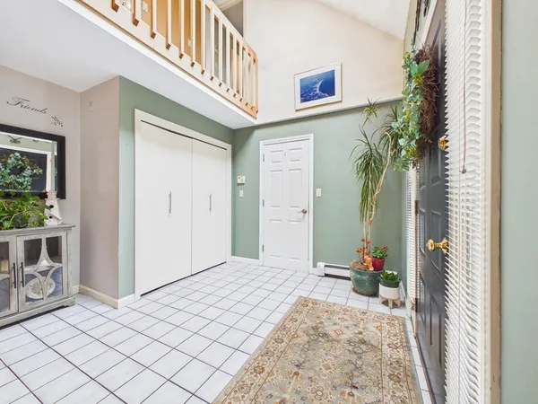 a view of a hallway to a livingroom and a fire pit