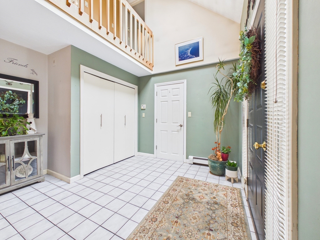 50 Prospect Avenue Hull, MA 02045 - Photo 2 of 41 a view of a hallway to a livingroom and a fire pit