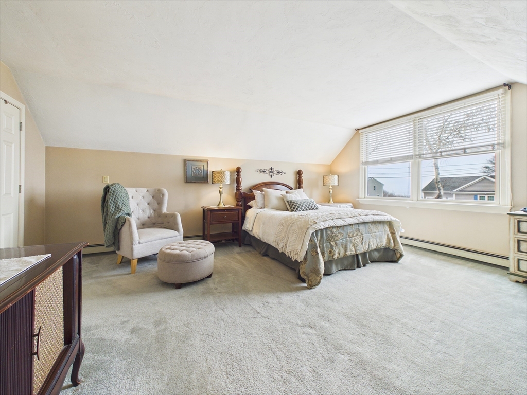 50 Prospect Avenue Hull, MA 02045 - Photo 22 of 41 a bedroom with bed and a large window