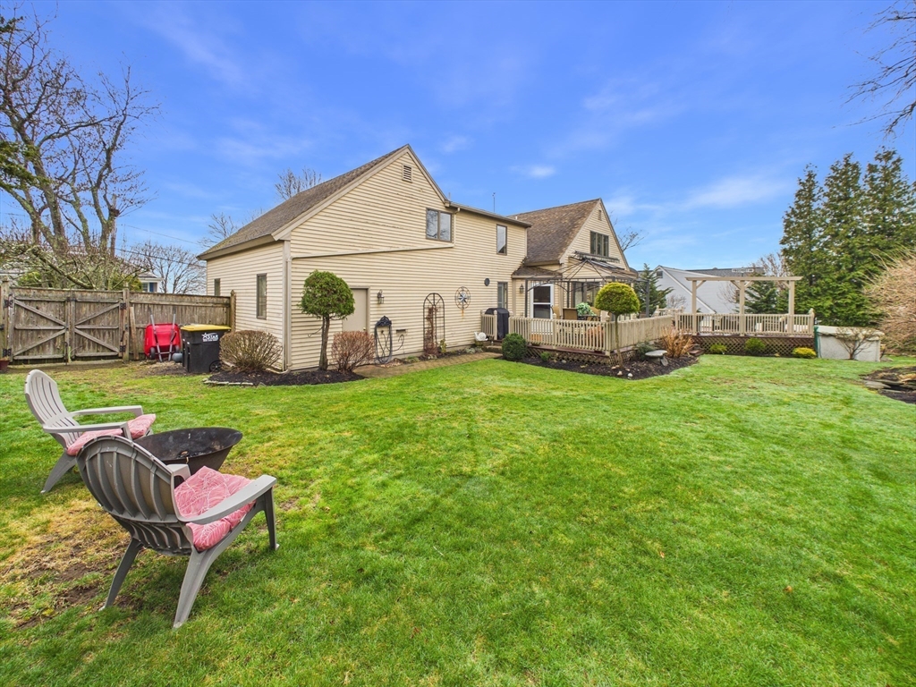 50 Prospect Avenue Hull, MA 02045 - Photo 32 of 41 a view of a chair and table in backyard of the house