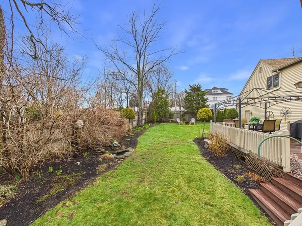 a view of a backyard with sitting area