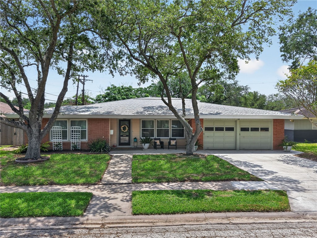 609 Peerman Place Corpus Christi, TX 78411 - Photo 1 of 36 a front view of a house with a yard