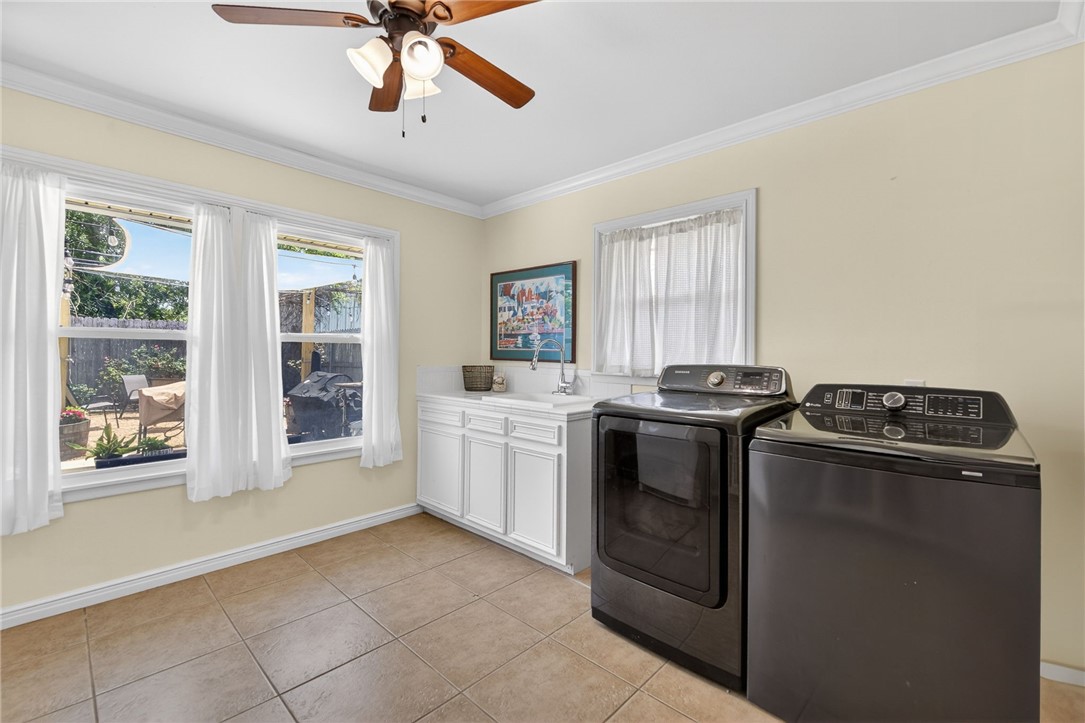609 Peerman Place Corpus Christi, TX 78411 - Photo 14 of 36 a kitchen with a stove top oven and cabinets