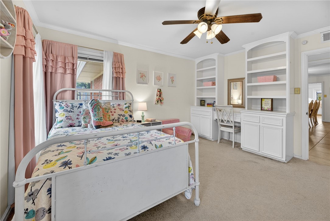 609 Peerman Place Corpus Christi, TX 78411 - Photo 20 of 36 a bedroom with a bed dresser and a window