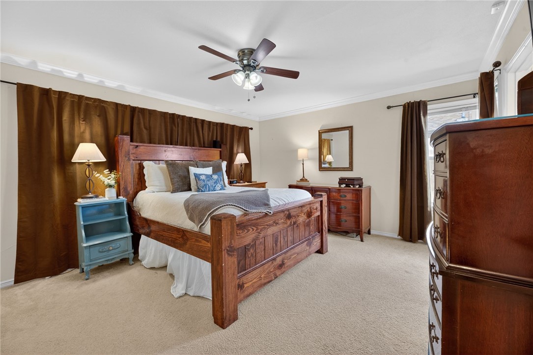 609 Peerman Place Corpus Christi, TX 78411 - Photo 22 of 36 a bedroom with a bed dresser and a window