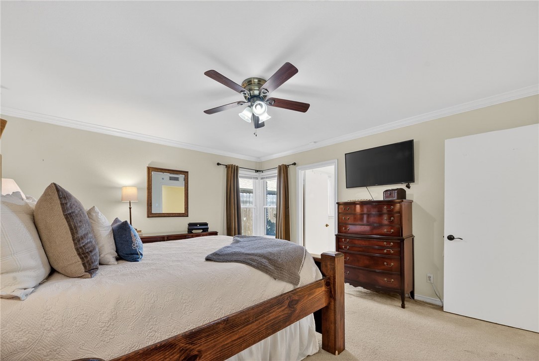 609 Peerman Place Corpus Christi, TX 78411 - Photo 23 of 36 a bed room with a bed and a television