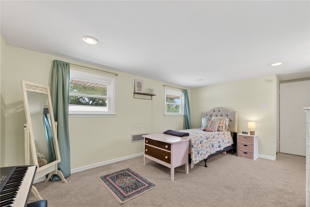 609 Peerman Place Corpus Christi, TX 78411 - Photo 27 of 36 a bedroom with bed and a window